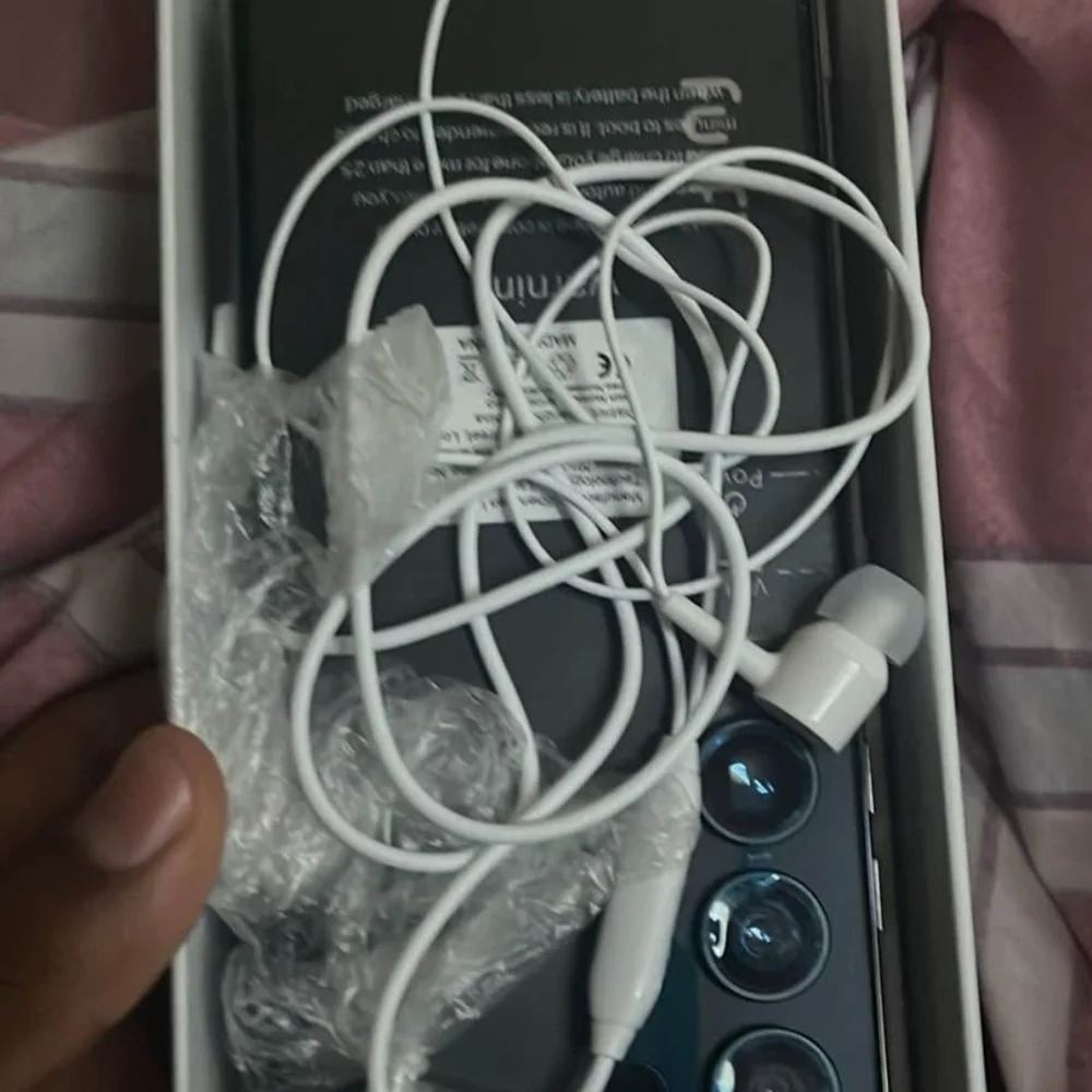 Samsung Smartphone with Black and White Accessories